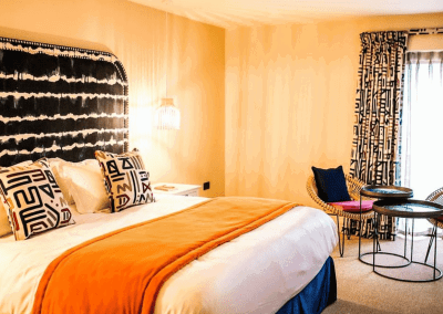 Interior of The Baraset Barn Hotel, Stratford-upon-Avon, featuring warm rustic textures, contract furniture and soft furnishings by Jameson Seating for a refined and relaxed guest experience.