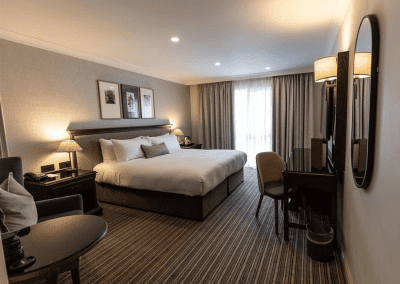 Hotel interior of DoubleTree Hilton Cheltenham, featuring contract hotel furniture and bespoke headboards to create an inviting and relaxed guest experience.