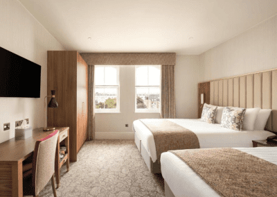 Bedroom interiors for a Victorian, seaside hotel featuring bespoke statement headboards, bedroom furniture and soft furnishings to complement the hotel’s aesthetic.