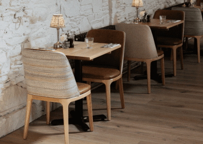 Interior of a country-style pub featuring contract furniture and soft furnishings, blending heritage charm with contemporary comfort.