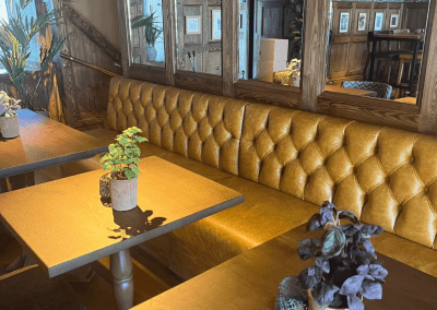 Interior of The Crown Bodedern featuring contract furniture and fixed seating for an elegant look, enhancing the character of this countryside gastropub.