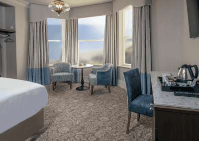 Bedroom interiors for a Victorian, seaside hotel featuring bespoke statement headboards, bedroom furniture and soft furnishings to complement the hotel’s aesthetic.