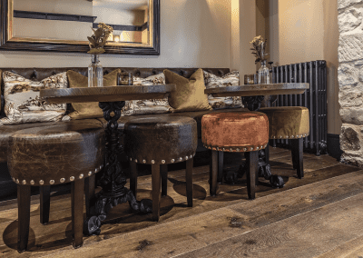 Interior of Ye Horns Inn, a grade II listed Inn featuring bespoke pub furniture including dining chairs, bar stools, and tables to enhance the heritage charm of the Inn.