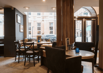 Pub interior featuring contract furniture and bespoke fixed seating.