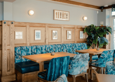 Interior of The Crown Bodedern featuring contract furniture and fixed seating for an elegant look, enhancing the character of this countryside gastropub.