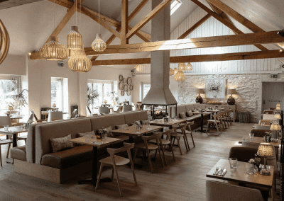 Interior of a country-style pub featuring contract furniture and soft furnishings, blending heritage charm with contemporary comfort.