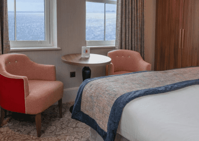 Bedroom interiors for a Victorian, seaside hotel featuring bespoke statement headboards, bedroom furniture and soft furnishings to complement the hotel’s aesthetic.