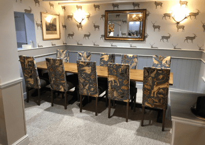 Interior of a family country inn featuring traditional fixed seating, dining and bar furniture, and refurbished pub furniture to enhance the heritage appeal of the pub.