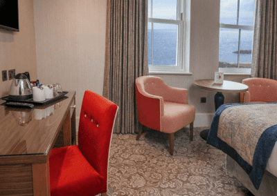 Bedroom interiors for a Victorian, seaside hotel featuring bespoke statement headboards, bedroom furniture and soft furnishings to complement the hotel’s aesthetic.