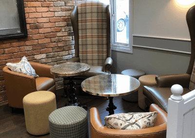 Interior of a family country inn featuring traditional fixed seating, dining and bar furniture, and refurbished pub furniture to enhance the heritage appeal of the pub.
