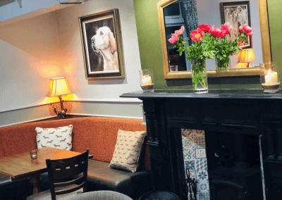 Interior of a family country inn featuring traditional fixed seating, dining and bar furniture, and refurbished pub furniture to enhance the heritage appeal of the pub.