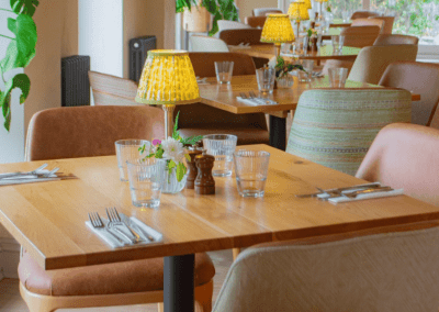 Interior of a country-style pub featuring contract furniture and soft furnishings, blending heritage charm with contemporary comfort.