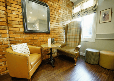 Interior of a family country inn featuring traditional fixed seating, dining and bar furniture, and refurbished pub furniture to enhance the heritage appeal of the pub.