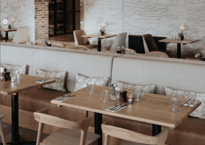 Interior of a country-style pub featuring contract furniture and soft furnishings, blending heritage charm with contemporary comfort.