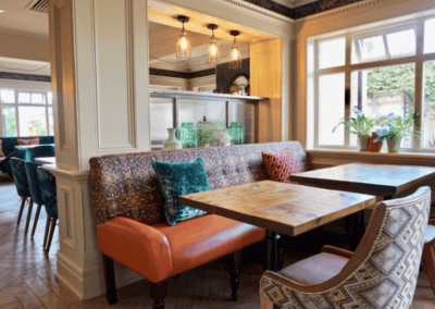 Bespoke pub furniture at Shipmans Northampton, including fixed seating, wooden dining tables, and classic chairs designed to enhance the pub’s historic charm.