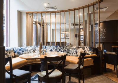 Pub interior of Bar Utopia, featuring contract furniture and bespoke fixed seating.