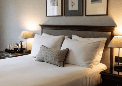 Hotel interior of DoubleTree Hilton Cheltenham, featuring contract hotel furniture and bespoke headboards to create an inviting and relaxed guest experience.