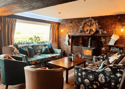 Interior of the dining and lounge areas for a countryside hotel, featuring furniture that complements its rich heritage and charming, traditional style.