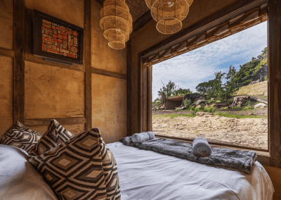 Interior of West Midlands Safari Park Lodges, a selection of safari inspired lodges with vibrant bedrooms, featuring bespoke curtains and soft furnishings with elegant styling.