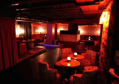 Interior of a stylish and immersive nightclub featuring bespoke soft furnishings and bespoke seating and furniture to enhance the nighttime atmosphere.