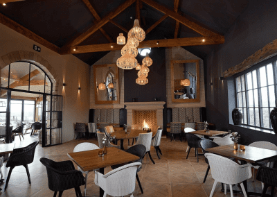 Interior of a grade II listed Inn featuring bespoke pub furniture including dining chairs, bar stools, and tables to enhance the heritage charm of the Inn.