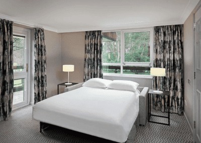 Hotel interior of Hilton Hotels, featuring contract hotel furniture and bespoke headboards to create an inviting and relaxed guest experience.