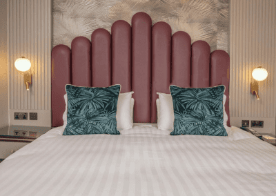 Bedroom interiors for Clifton Hotel, a Victorian, seaside hotel featuring bespoke statement headboards, bedroom furniture and soft furnishings to complement the hotel’s aesthetic.