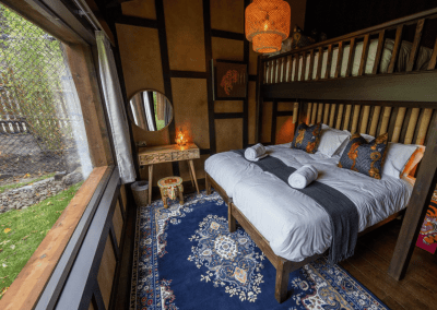Interior of West Midlands Safari Park Lodges, a selection of safari inspired lodges with vibrant bedrooms, featuring bespoke curtains and soft furnishings with elegant styling.