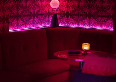 Interior of a stylish and immersive nightclub featuring bespoke soft furnishings and bespoke seating and furniture to enhance the nighttime atmosphere.