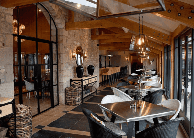 Interior of a grade II listed Inn featuring bespoke pub furniture including dining chairs, bar stools, and tables to enhance the heritage charm of the Inn.