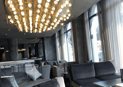 Bespoke wave voile curtains at Opheem Birmingham, enhancing the restaurant’s modern and elegant interior with tailored soft furnishings.