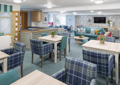 Interior of a retirement home featuring comfortable and supportive dining and lounge furniture for independent and retirement living.