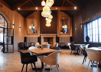 Interior of a grade II listed Inn featuring bespoke pub furniture including dining chairs, bar stools, and tables to enhance the heritage charm of the Inn.
