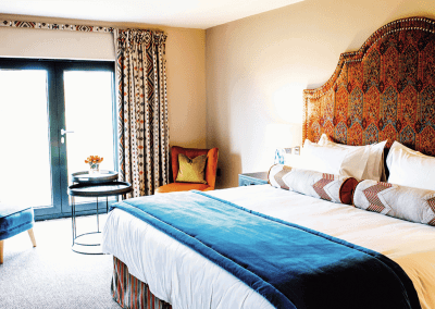 Interior of a barn hotel, featuring warm rustic textures, contract furniture and soft furnishings by Jameson Seating for a refined and relaxed guest experience.