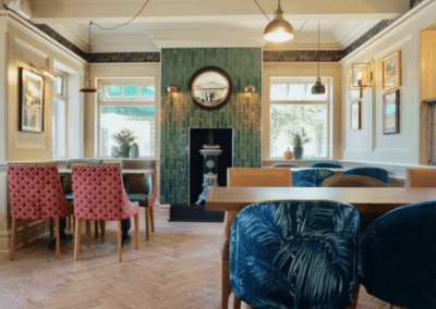 Bespoke pub furniture at Shipmans Northampton, including fixed seating, wooden dining tables, and classic chairs designed to enhance the pub’s historic charm.