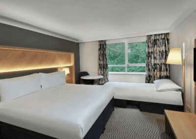 Hotel interior featuring contract hotel furniture and bespoke headboards to create an inviting and relaxed guest experience.