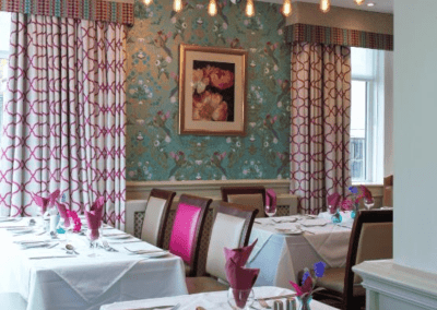 Interiors of a coastal hotel featuring contract furniture, lounge seating, bedroom furniture, and bespoke curtains, pelmets, and blinds reflecting the hotel’s vibrant coastal design.