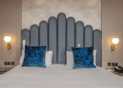 Bedroom interiors for Clifton Hotel, a Victorian, seaside hotel featuring bespoke statement headboards, bedroom furniture and soft furnishings to complement the hotel’s aesthetic.