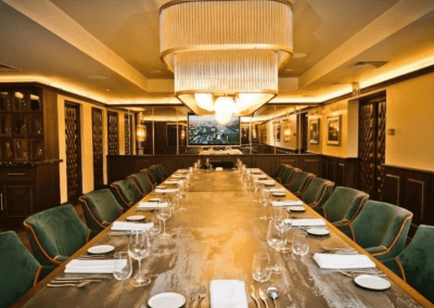Interior of a boutique hotel with sophisticated private dining room, featuring bespoke restaurant furniture with elegant detailing.
