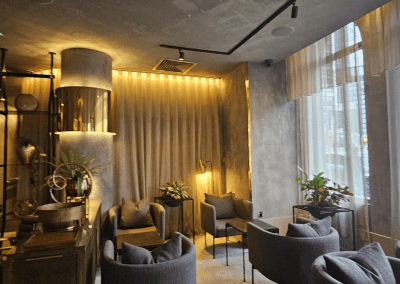 Bespoke wave voile curtains at a Michelin star restaurant, enhancing the modern and elegant interior with tailored soft furnishings.