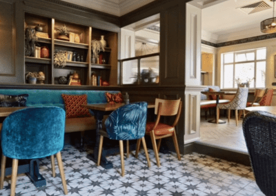 Bespoke pub furniture at Shipmans Northampton, including fixed seating, wooden dining tables, and classic chairs designed to enhance the pub’s historic charm.