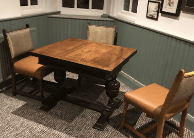 Pub interior featuring contract furniture and bespoke curtains.
