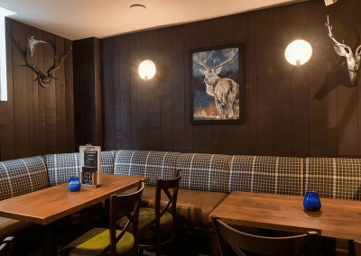 Pub interior featuring contract furniture and bespoke fixed seating.
