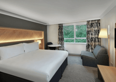 Hotel interior featuring contract hotel furniture and bespoke headboards to create an inviting and relaxed guest experience.