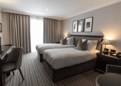 Hotel interior featuring contract hotel furniture and bespoke headboards to create an inviting and relaxed guest experience.