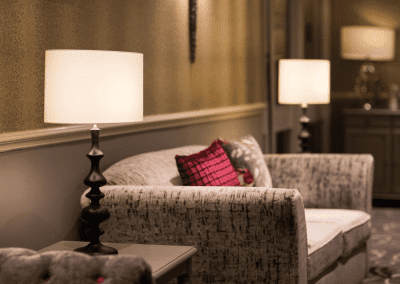 Interiors of a coastal hotel featuring contract furniture, lounge seating, bedroom furniture, and bespoke curtains, pelmets, and blinds reflecting the hotel’s vibrant coastal design.