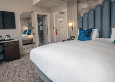 Bedroom interiors for a Victorian, seaside hotel featuring bespoke statement headboards, bedroom furniture and soft furnishings to complement the hotel’s aesthetic.