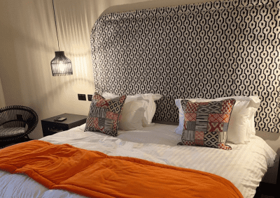 Interior of a barn hotel, featuring warm rustic textures, contract furniture and soft furnishings by Jameson Seating for a refined and relaxed guest experience.