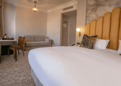 Bedroom interiors for a Victorian, seaside hotel featuring bespoke statement headboards, bedroom furniture and soft furnishings to complement the hotel’s aesthetic.
