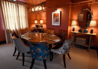 Interior of a grade II listed Inn featuring bespoke pub furniture including dining chairs, bar stools, and tables to enhance the heritage charm of the Inn.